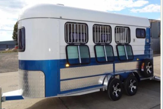 white two horse trailer with side windows and ventilation